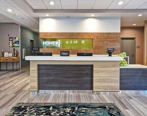 Reception desk at Home2 Suites By Hilton San Francisco Airport North.