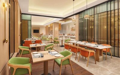 Dining area at Hilton Garden Inn Surat City Centre.