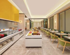 Dining area at Hilton Garden Inn Surat City Centre.