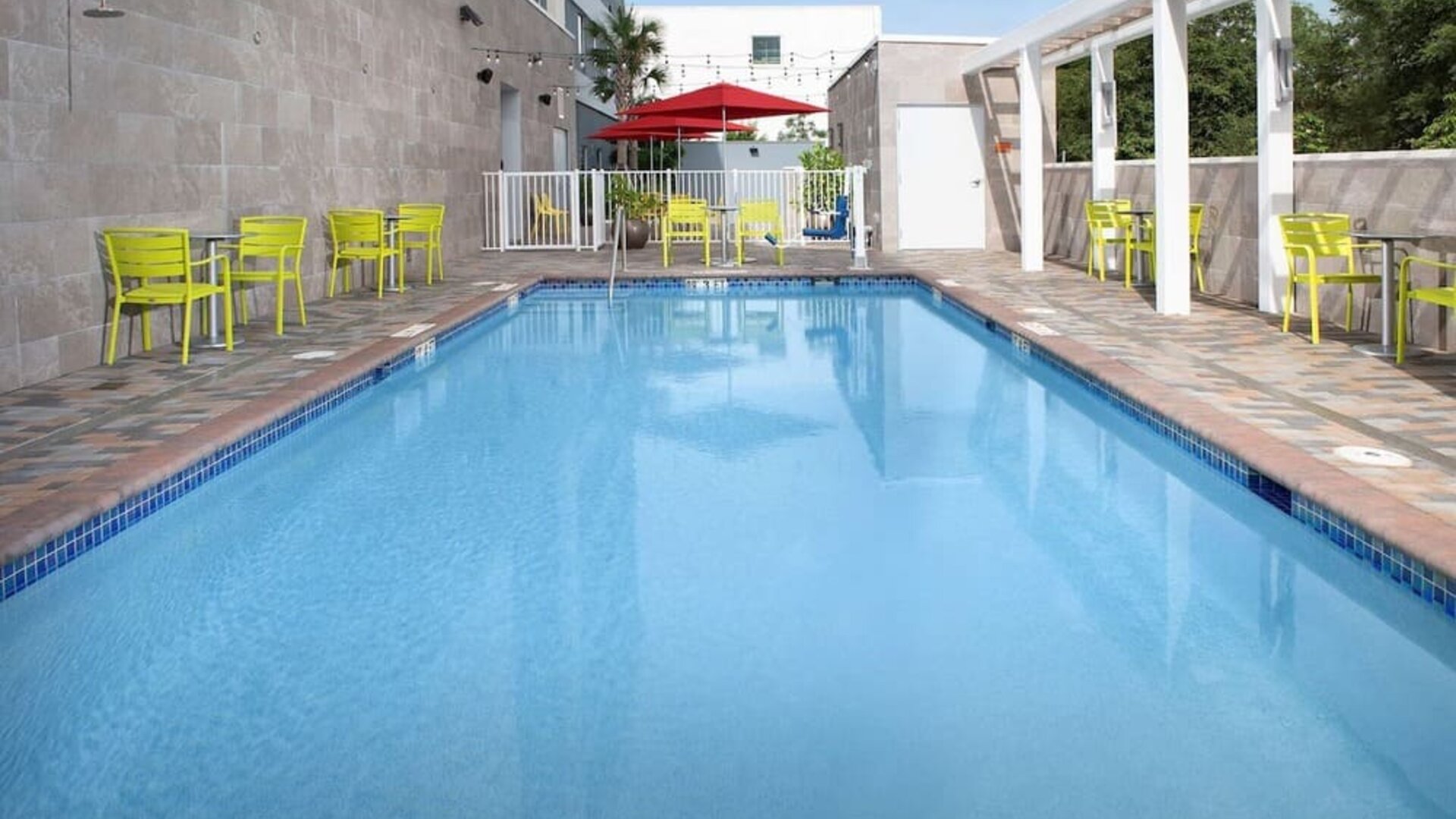 Outdoor pool at Home2 Suites By Hilton Miami Doral West Airport.