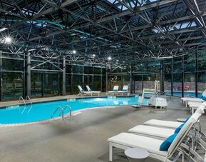 Indoor pool surrounded with loungers at Westin Atlanta Airport Hotel.