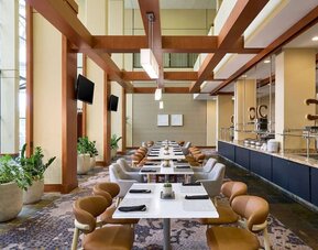 Dining area with natural light perfect for coworking at Westin Atlanta Airport Hotel.
