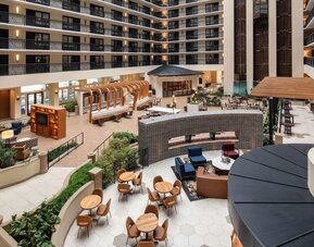 Ample seats perfect for coworking in the atrium of Embassy Suites by Hilton San Francisco Airport.
