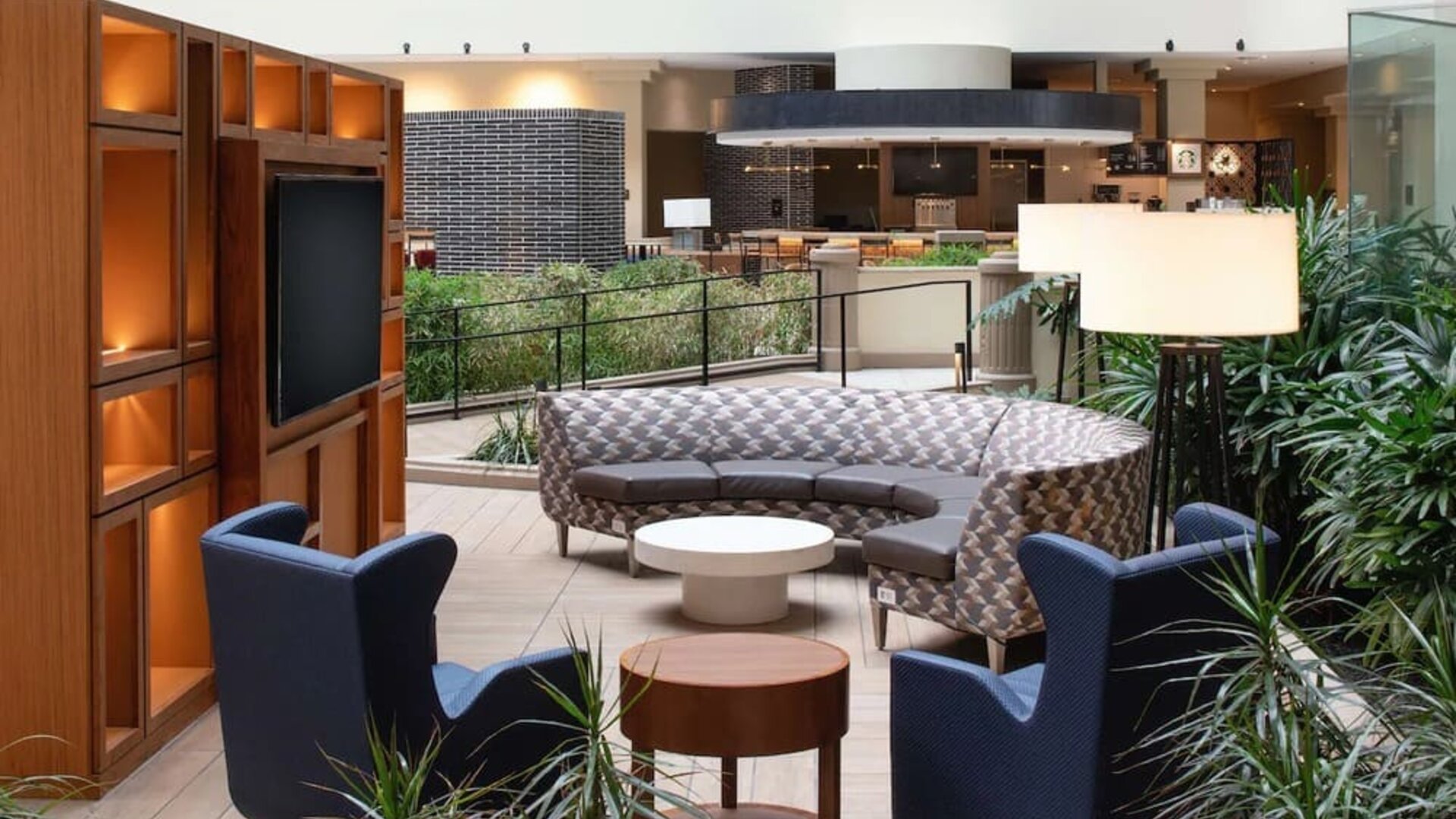 Elegant coworking area in the hotel lobby of the Embassy Suites by Hilton San Francisco Airport.