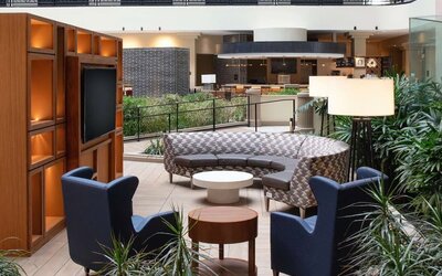 Elegant coworking area in the hotel lobby of the Embassy Suites by Hilton San Francisco Airport.