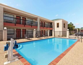 Outdoor pool at Days Inn By Wyndham San Antonio Near Fiesta Park.