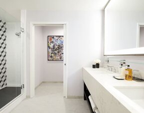 Private guest bathroom with shower and free toiletries at Montrose At Beverly Hills.