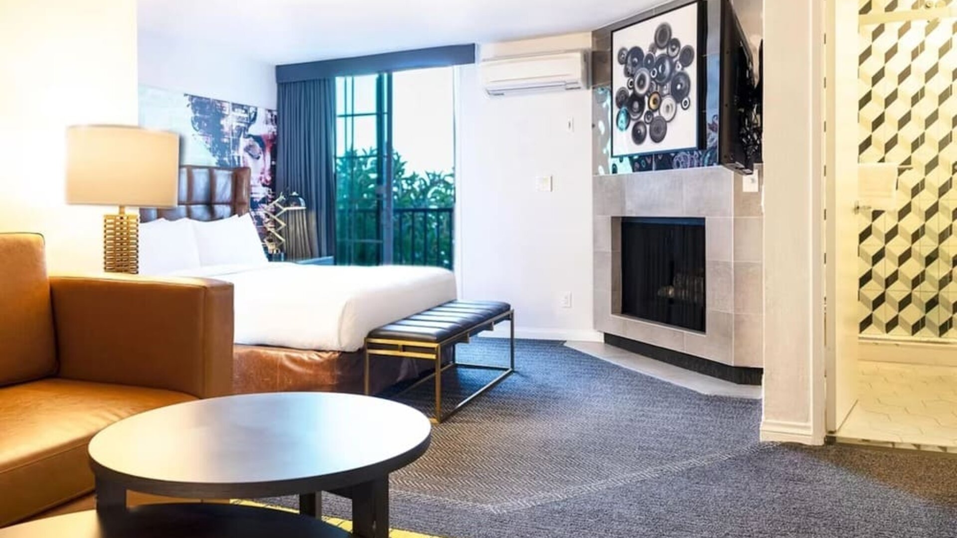 Day use suite with living room and fireplace at Montrose At Beverly Hills.