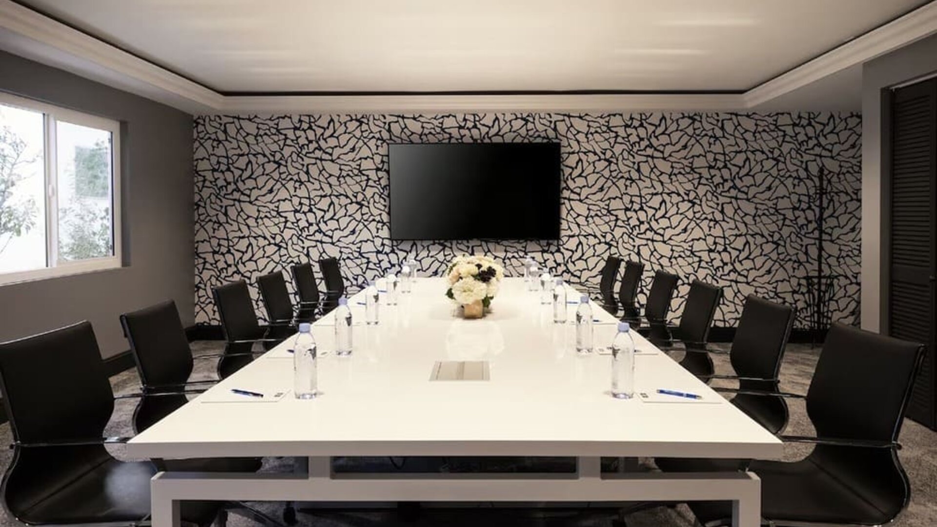 Professional meeting room with ergonomic chairs at Montrose At Beverly Hills.