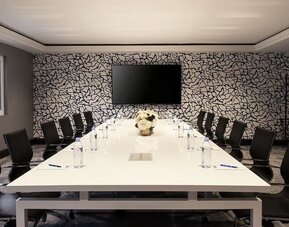 Professional meeting room with ergonomic chairs at Montrose At Beverly Hills.