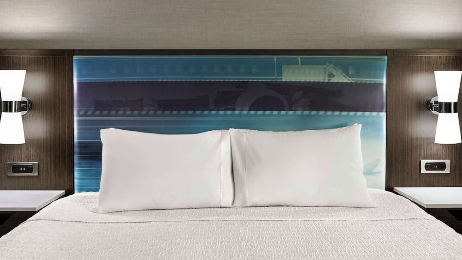 Comfortable king bed at Hampton Inn Chicago-O'Hare International Airport.