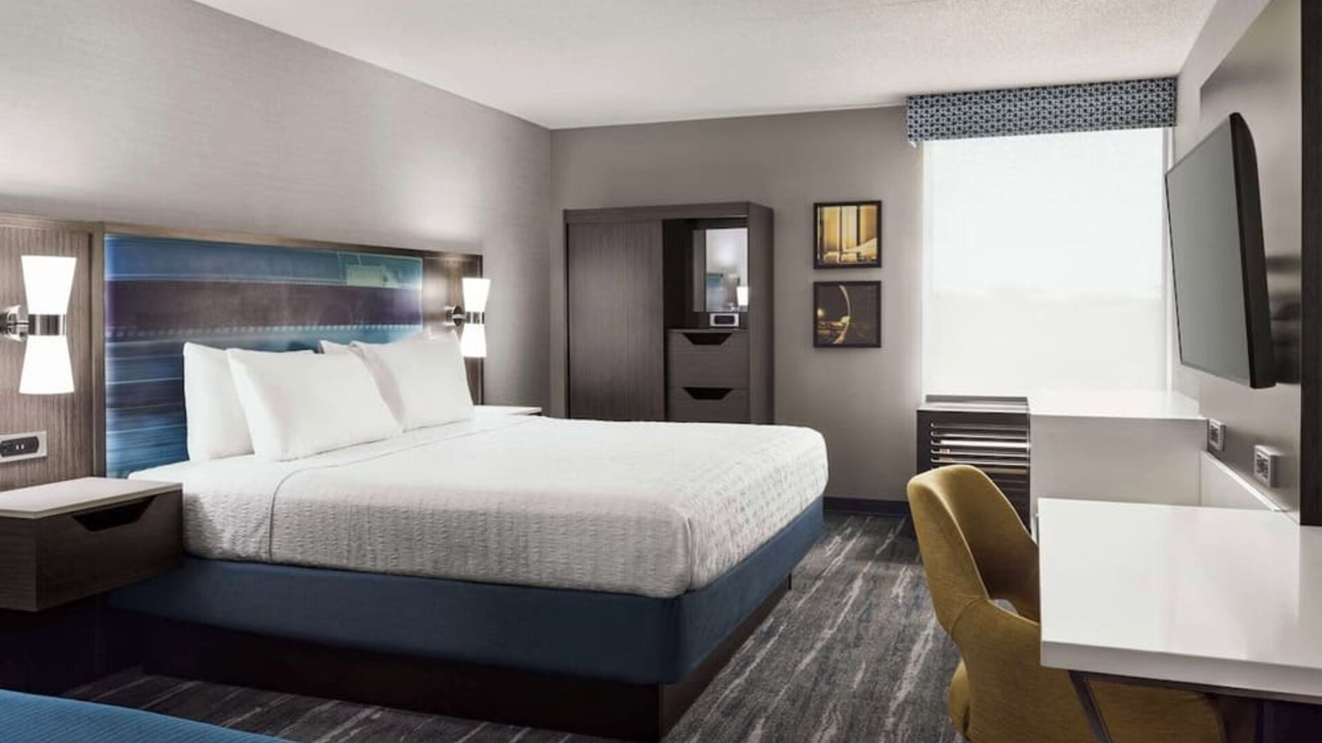 Day use room with work desk, private bathroom and natural light at Hampton Inn Chicago-O'Hare International Airport.