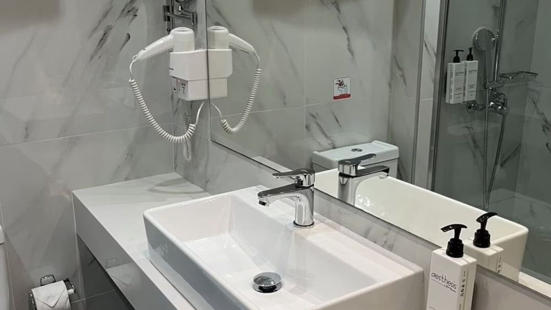 Guest bathroom at Boss Boutique Athens.