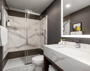 Guest bathroom at Crowne Plaza Saint John Harbour View By IHG.