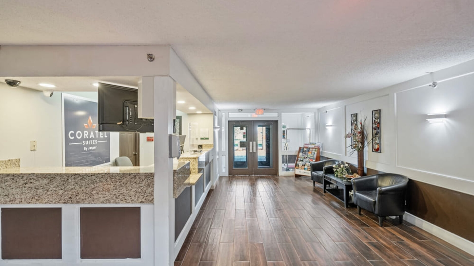Reception desk at Coratel Plus Suites Wichita West Airport.