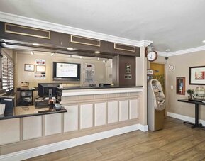 Reception desk at Lemon Tree Hotel & Suites Anaheim.