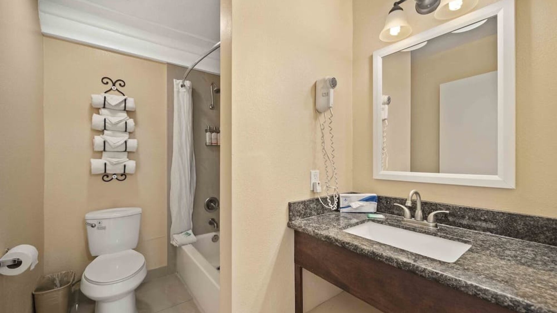 Guest bathroom at Lemon Tree Hotel & Suites Anaheim.