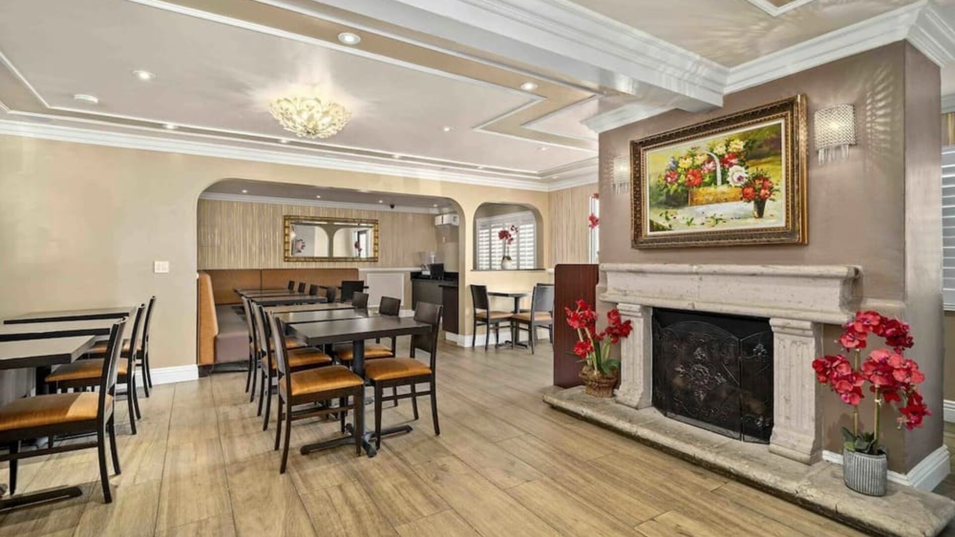 Lobby seating and restaurant at Lemon Tree Hotel & Suites Anaheim.