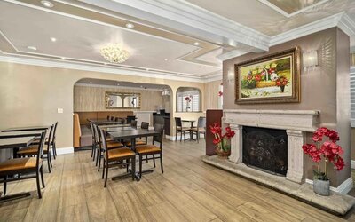 Lobby seating and restaurant at Lemon Tree Hotel & Suites Anaheim.