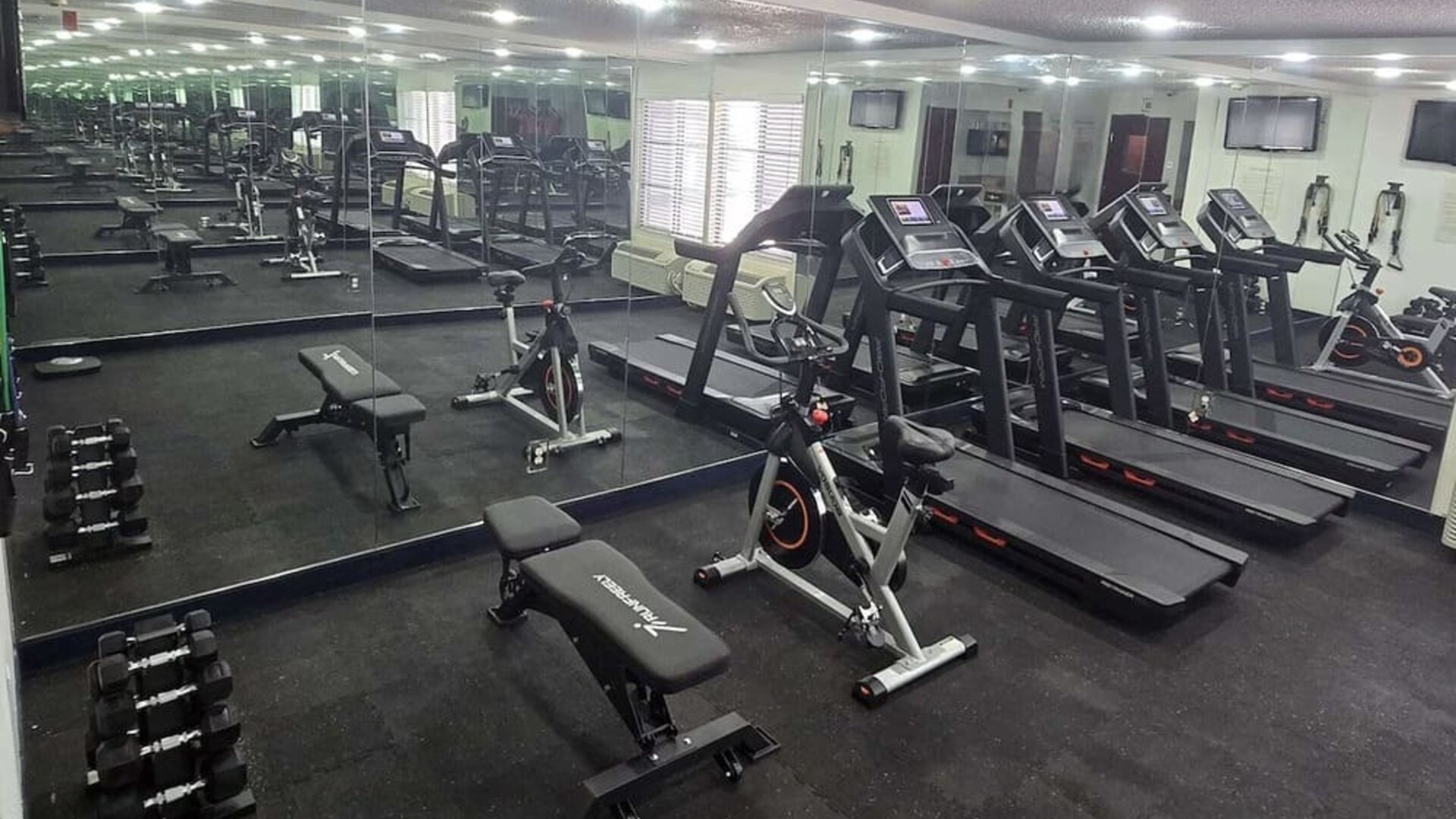 Fitness center at Quality Inn & Suites Irving DFW Airport South.