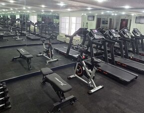 Fitness center at Quality Inn & Suites Irving DFW Airport South.