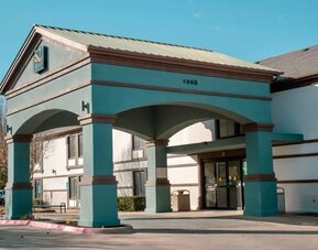 Hotel exterior at Quality Inn & Suites Irving DFW Airport South.