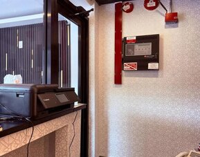 Reception desk at THE VINE HOTEL BRONX.