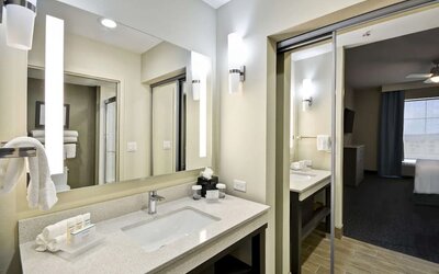 Guest bathroom at Homewood Suites By Hilton Orlando Theme Parks.