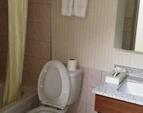 Guest bathroom at Baymont By Wyndham Montreal Airport.