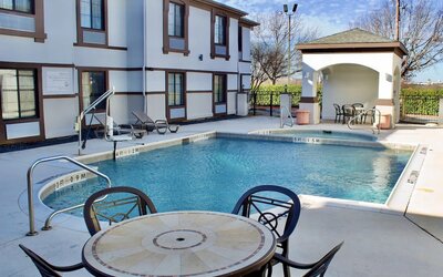 Outdoor pool at Quality Inn & Suites Irving DFW Airport South.