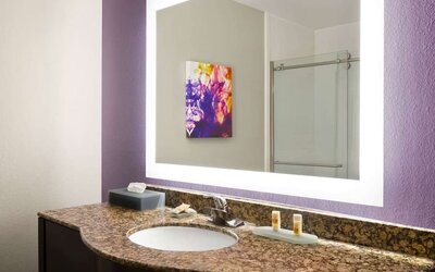 Guest bathroom at La Quinta Inn & Suites By Wyndham Lackawanna.
