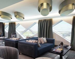 Coworking space with natural light at Hilton Amsterdam Airport Schiphol.