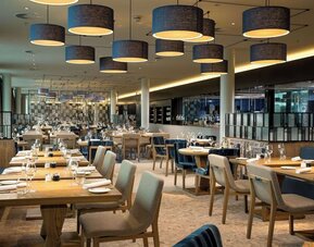 Dining area perfect for coworking at Hilton Amsterdam Airport Schiphol.