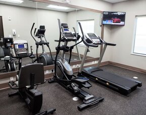 Gym at Days Inn & Suites By Wyndham Houston NW Cypress.
