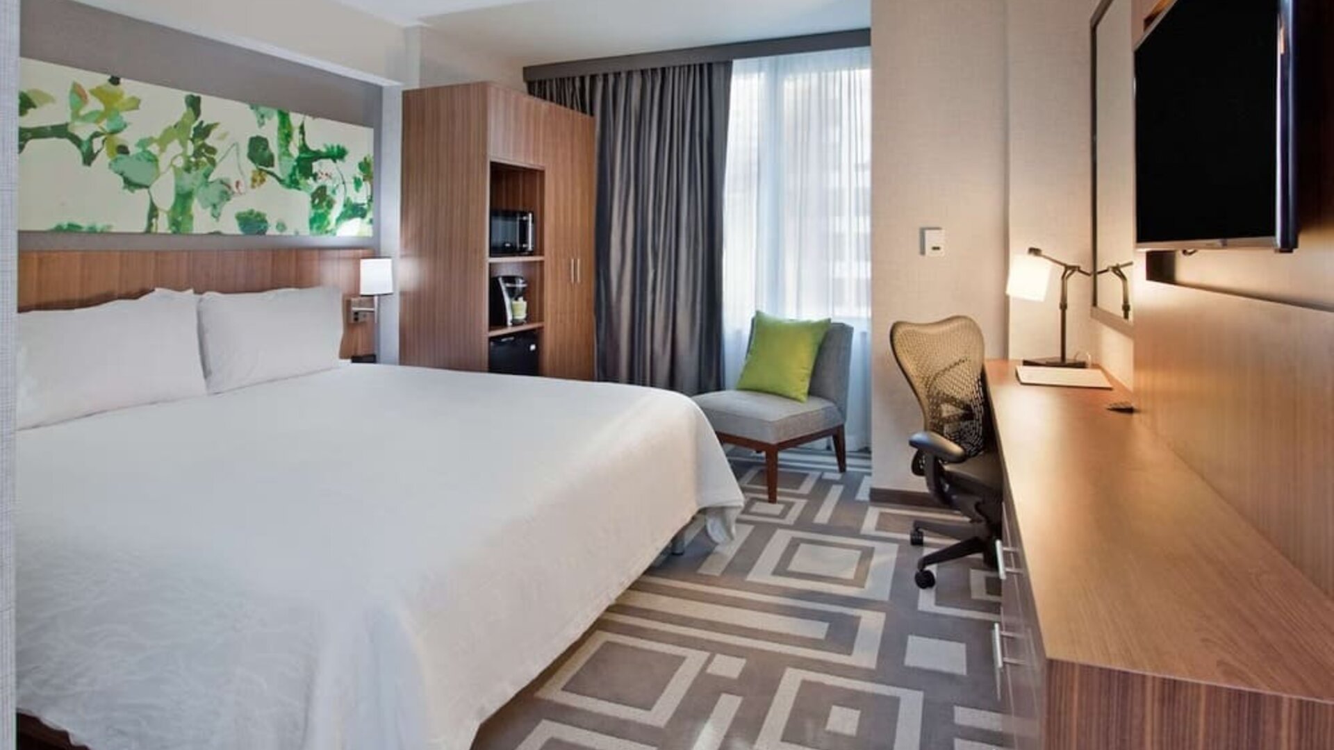 Day use room with work desk and natural light at Hilton Garden Inn New York Central Park South Mid-town West.