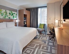 Day use room with work desk and natural light at Hilton Garden Inn New York Central Park South Mid-town West.