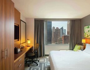 Day use room with work desk and natural light at Hilton Garden Inn New York Central Park South Mid-town West.