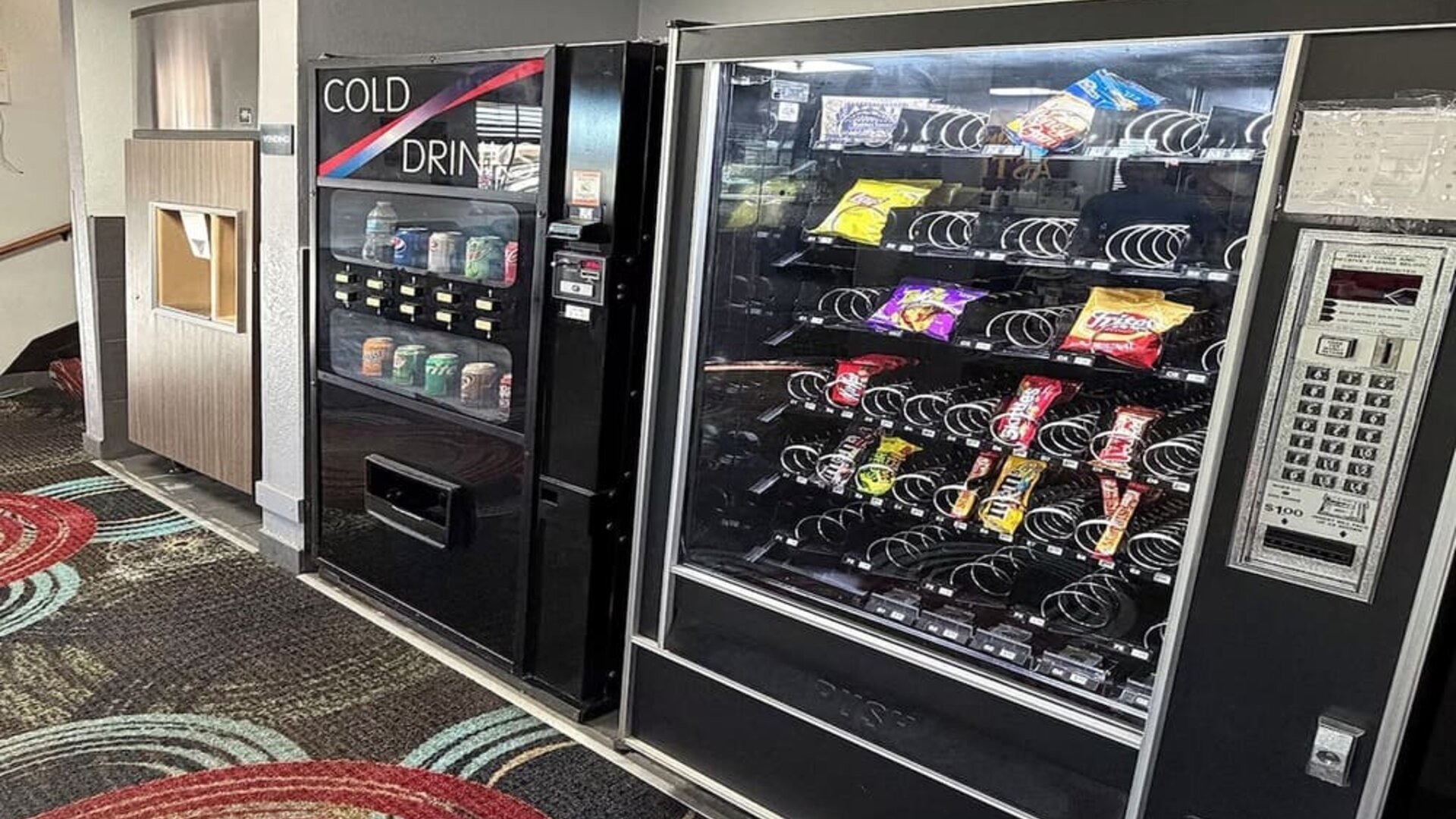 Vending machine at Coratel Inn And Suites By Jasper Stillwater.