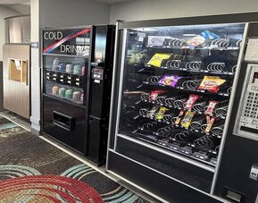 Vending machine at Coratel Inn And Suites By Jasper Stillwater.