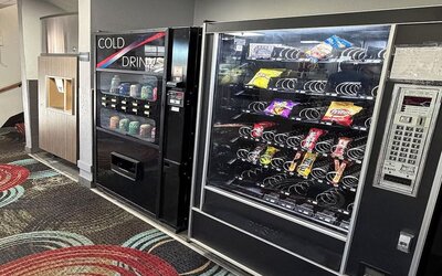 Vending machine at Coratel Inn And Suites By Jasper Stillwater.