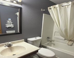 Guest bathroom at Coratel Inn And Suites By Jasper Stillwater.