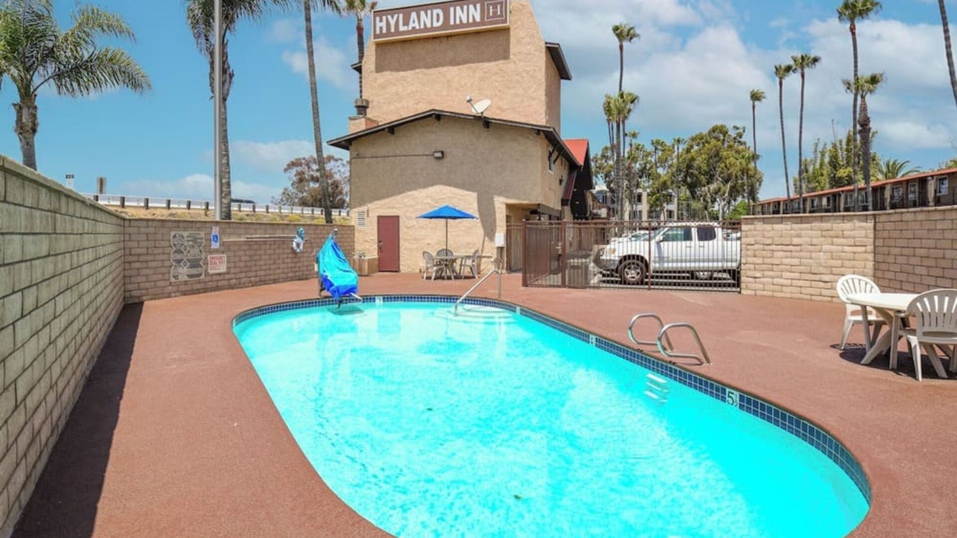 Outdoor pool at Hyland Inn Near Legoland.