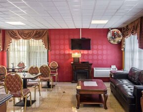 Lobby and coworking lounge at Rodeway Inn Huntington Station.