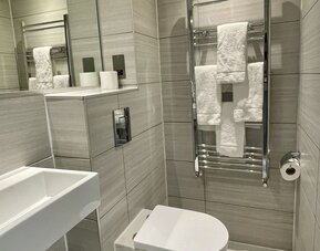 Guest bathroom at The Chapter - Leisure Inn Hotel.