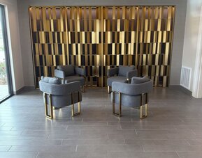 Lobby seating at Palace Inn Blue 290 W 43rd & Bingle Rd.