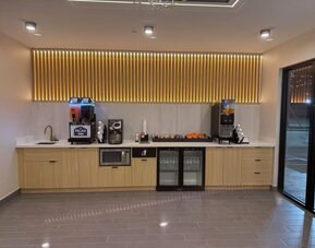 Coffee station at Palace Inn Blue 290 W 43rd & Bingle Rd.