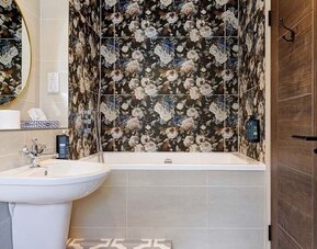 Bathroom at Thatcher's Hotel - Surya Hotels.