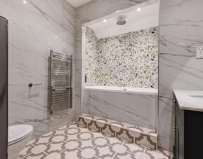 Bathroom at Thatcher's Hotel - Surya Hotels.