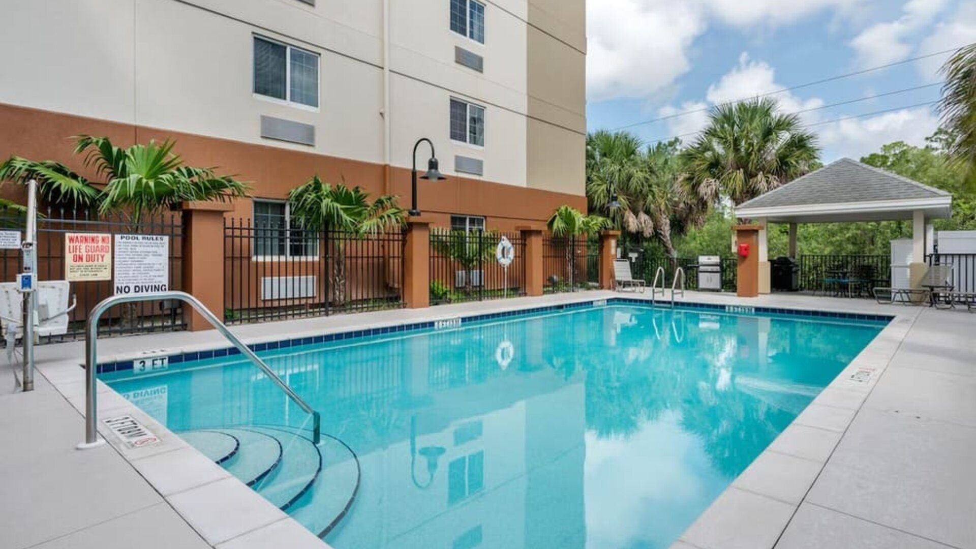 Outdoor pool at Candlewood Suites Fort Myers/Sanibel Island.
