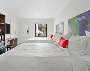 Day room with workspace and natural light at Baymont By Wyndham Jacksonville Airport.
